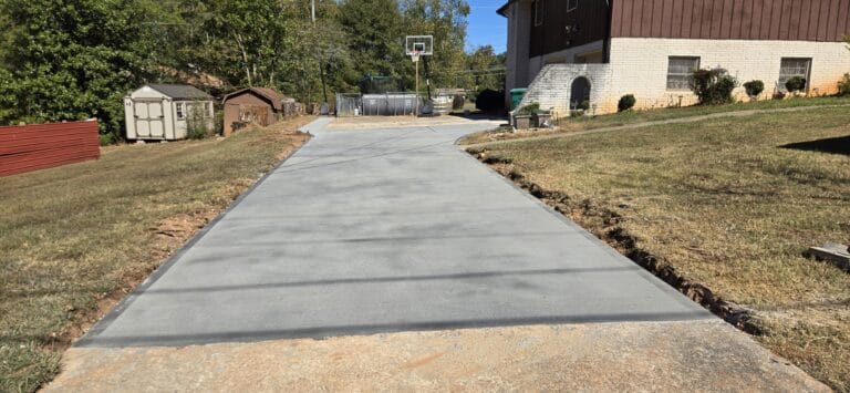 Concrete driveway by Rodriguez Innovation Concrete showcasing high-quality craftsmanship and smooth finish.