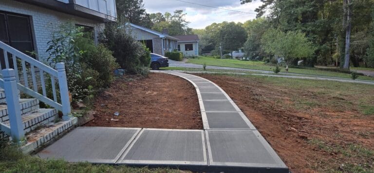 Durable concrete sidewalk curbing installed by Rodriguez Innovation Concrete for enhanced outdoor pathways.